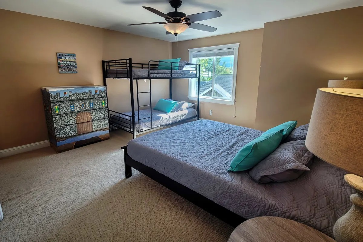 Upper bedroom with queen and bunks